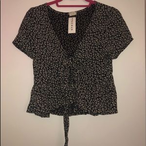 Floral tee, tie blouse.